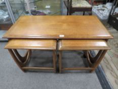 A RETRO TEAK G-PLAN STYLE NEST OF TABLES W-99CM