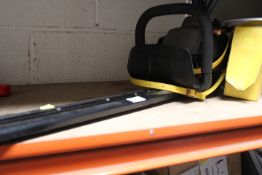 A TITAN TTL531 HDE PETROL HEDGE CUTTER WITH A CASED LOOP TESTER