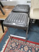 A PAIR OF MODERN DARK LEATHER KITCHEN STOOLS