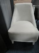 A MODERN UPHOLSTERED BEDROOM CHAIR