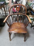 A TRADITIONAL ANTIQUE ELM WINDSOR ARMCHAIR