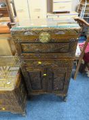 A CARVED EASTERN HARDWOOD CABINET WITH GLASS TOP H-98 W-56 CM
