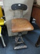 A MODERN TAN LEATHER AND METAL INDUSTRIAL STYLE STOOL