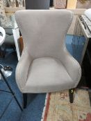 A MODERN UPHOLSTERED GREY SHAPED ARMCHAIR
