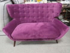 A MODERN UPHOLSTERED PURPLE SETTEE W-138 CM