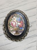 AN ANTIQUE SILVER MICRO MOSAIC BROOCH
