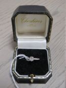 A HALLMARKED 18 CARAT WHITE GOLD OVAL DIAMOND SOLITAIRE RING, the central diamond being an