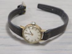 A VINTAGE LADIES OMEGA WRISTWATCH ON LEATHER STRAP