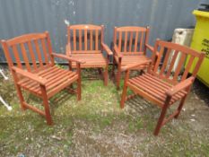 A SET OF FOUR HARDWOOD GARDEN ARMCHAIRS