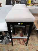 A SET OF THREE MODERN UPHOLSTERED KITCHEN STOOLS