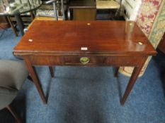 A GEORGIAN MAHOGANY FOLD-OVER SUPPER TABLE