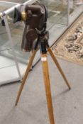 A VINTAGE SURVEYING TELESCOPE / GUN SIGHT ON FOLDING TRIPOD STAND