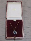 A 9CT GOLD SAPPHIRE PENDANT NECKLACE