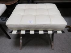 A MODERN BARCELONA TYPE STOOL WITH CHROMED BASE