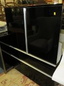 A MODERN BLACK GLOSS CABINET WITH TWO DRAWERS BELOW H-130 W-100 CM