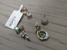 A SMALL COLLECTION OF GEM SET GOLD PENDANTS