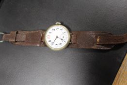 A LARGE OVER SIZED TRENCH ANTIQUE WRIST WATCH