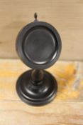 AN ANTIQUE EBONY POCKET WATCH STAND