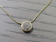 A LADIES YELLOW METAL DIAMOND SET PENDANT ON A 750 MARKED CHAIN