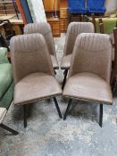 A MODERN SET OF FOUR UPHOLSTERED DINING CHAIRS