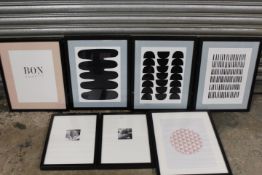 A COLLECTION OF SEVEN BLACK FRAMED MODERN PRINTS
