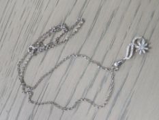 A LADIES 10K DIAMOND SET WHITE GOLD PENDANT ON A 9CT WHITE GOLD CHAIN