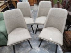 A MODERN SET OF FOUR UPHOLSTERED DINING CHAIRS