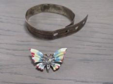 A STERLING SILVER BELT TYPE BANGLE TOGETHER WITH A VINTAGE ENAMEL BROOCH