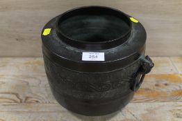 AN ORIENTAL BRONZED TWIN HANDLED JARDINIERE