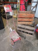 A VINTAGE PAINT LINE ROLLER TOGETHER WITH TWO VINTAGE WOODEN DRINKS CRATES