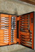 A WEBBER AND HILL RETRO STYLE CONTINENTAL STAINLESS STEEL CASED CANTEEN OF CUTLERY