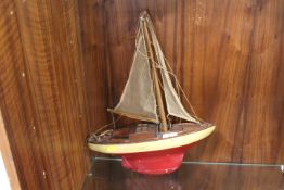 A VINTAGE POND YACHT