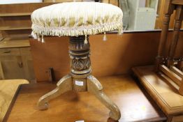 AN ANTIQUE MAHOGANY CARVED REVOLVING STOOL