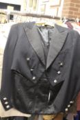 TWO VINTAGE UNIFORM JACKETS COMPRISING A SCOTTISH POLICE JACKET AND INDIAN RAJ BRITISH JACKET