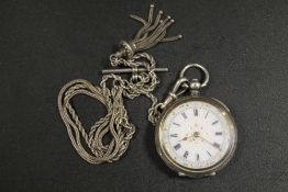 AN ANTIQUE SILVER LADIES POCKET WATCH ON SILVER ALBERTINA CHAIN