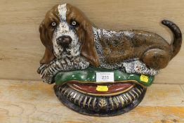 A CAST DOOR STOP IN THE SHAPE OF BASSETT HOUND