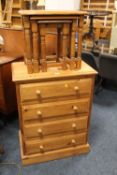 A MODERN PINE FOUR DRAWER CHEST AND A NEST OF TABLES
