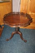 A REPRODUCTION MAHOGANY TRIPOD TABLE WITH GALLERY RAIL
