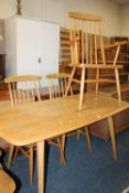 AN ERCOL STYLE LIGHT REFECTORY TABLE TOGETHER WITH THREE STICKBACK DINING CHAIRS