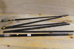 TWO VINTAGE WALKING STICKS - ONE WITH A DOG FINIAL, TOGETHER WITH A MEASURING STICK