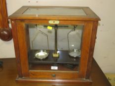 A CASED SET OF CHEMISTS BALANCE SCALES