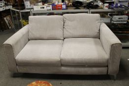 A MODERN TWO SEATER SETTEE