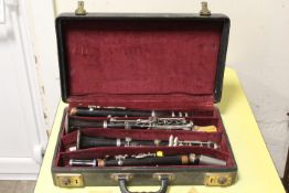 A CASE CONTAINING A VINTAGE SELMER CLARINET STYLE INSTRUMENT PIECES - NOT CHECKED