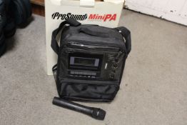 A PROSOUND PORTABLE MINI PA SYSTEM WITH MICROPHONE - NOT CHECKED