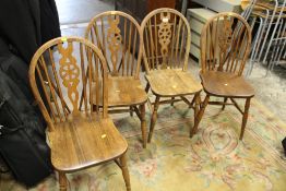 A SET OF FOUR WHEELBACK CHAIRS