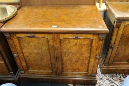 A VICTORIAN WALNUT TWO DOOR CABINET WITH CARVED DETAIL W 91 CM