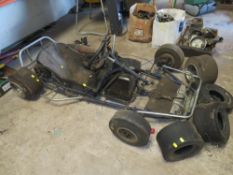 A CARCASS OF A PETROL POWERED RACING GO CART