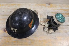 A VINTAGE V.T. MILITARY TIN HELMET ETC