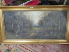 A GILT FRAMED OIL ON CANVAS OF A WOODED LANDSCAPE SIGNED LOWER LEFT