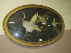 A ANTIQUE OVAL FRAMED SILKWORK DEPICTING BIRDS IN FLIGHT W 92 CM